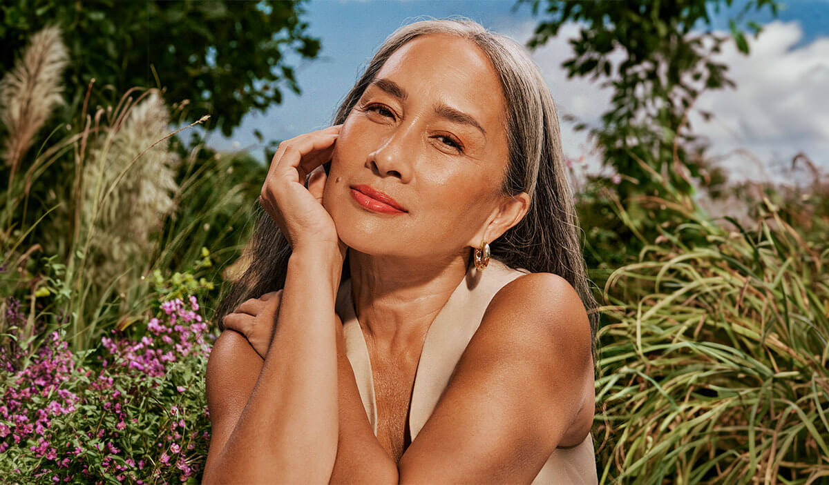 Woman wearing sunscreen and makeup