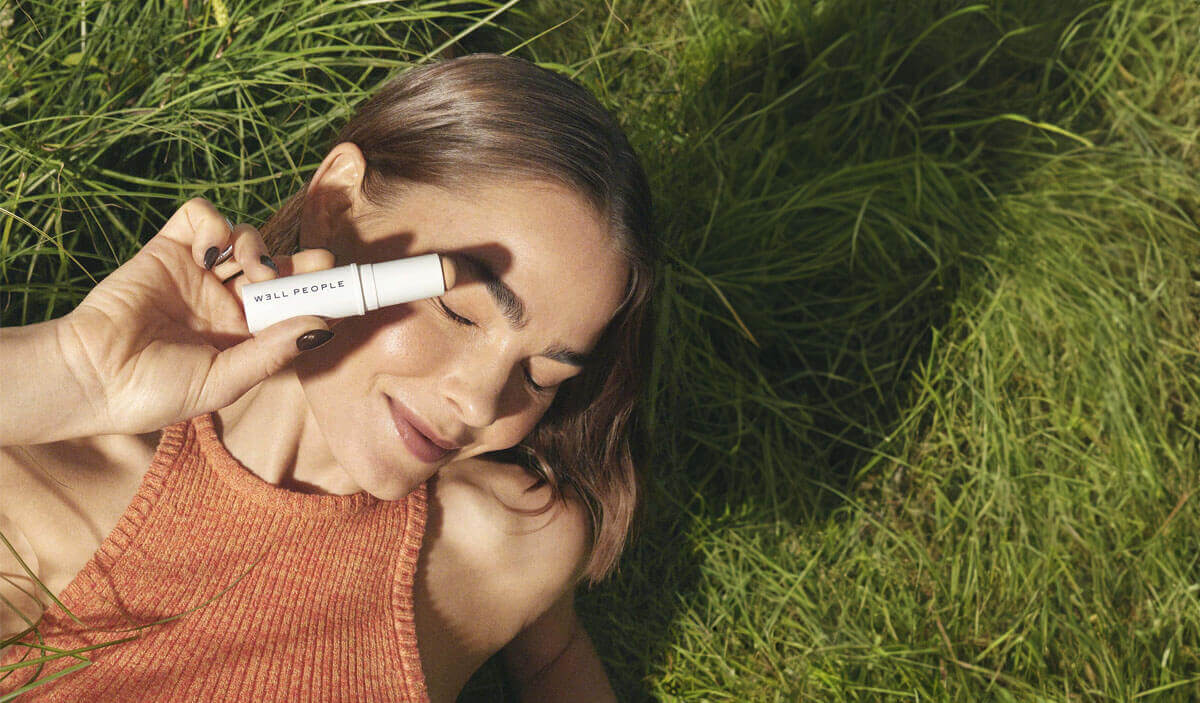 woman wearing stick cream foundation