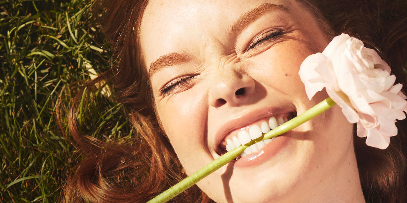 Woman wearing well people makeup and skincare