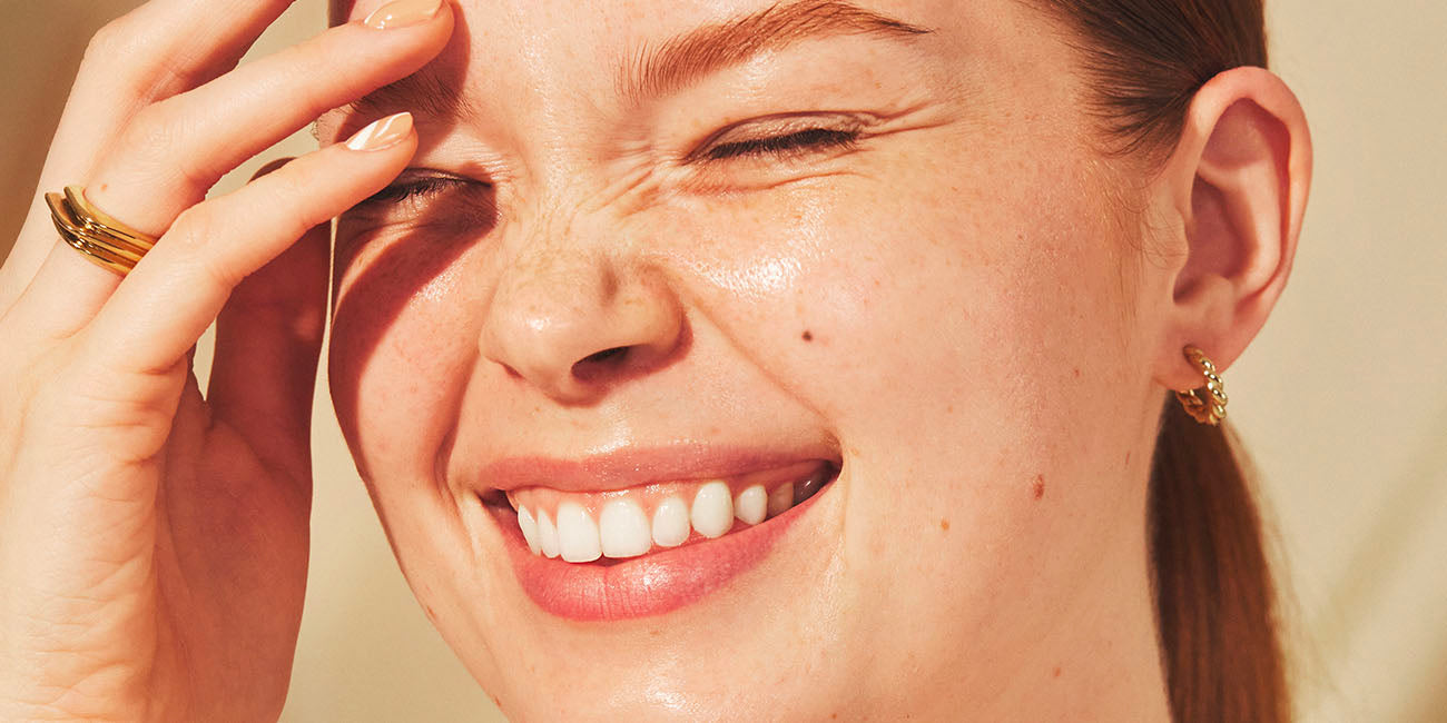 Woman wearing well people skincare