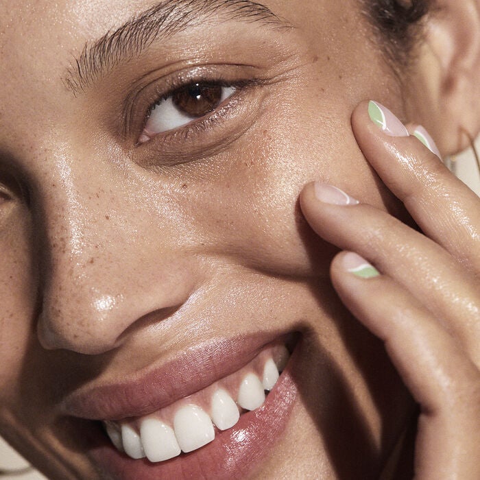 woman applying facial oil